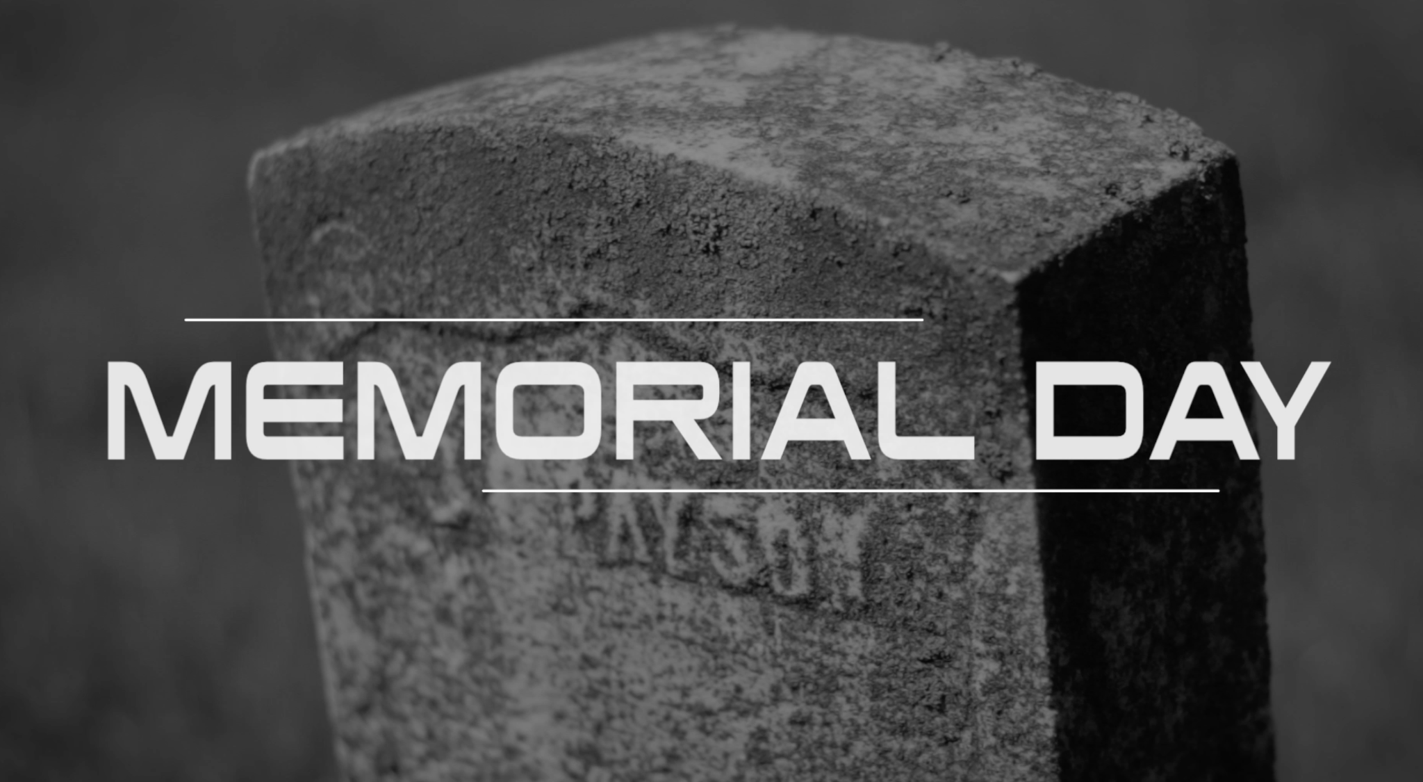 Memorial Day in white lettering over a black-and-white image of a gravestone